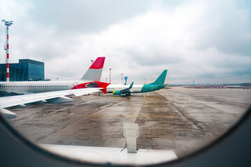 Wall Mural - view through window of aircraft during flight