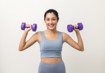 Wall Mural - Sporty Asian woman exercises with dumbbells on isolated white background. Good shape and health fitness woman weight training standing pose smile to camera.