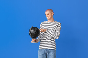 Sticker - Young guy with globe on blue background