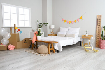 Poster - Interior of bedroom with toy cardboard ship and balloons