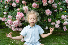 Girl With Eyes Closed Meditating At Rose Garden