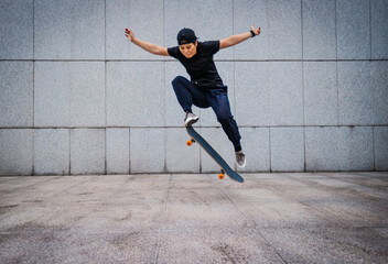 Asian woman skateboarder skateboarding in modern city