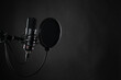 Close up image of professional studio microphone on the black background during voice recording