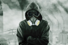 Hooded Man Wearing Gas Mask In The Polluted City