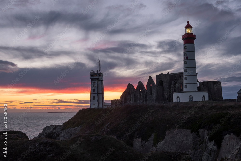 Sunset at Saint Mathieu Lighthouse with ancient ruin below the ...