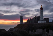 Sunset At Saint Mathieu Lighthouse With Ancient Ruin Below The Lighthouse Tower, Finistere, Brittany