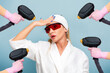 © _KUBE_ - Portrait of a young frightened woman in protective glasses holding at head. Many hands holding a laser devices. The concept of laser surgery and hair removal