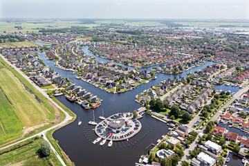 Sticker - Aerial top shot from houses with boats in Friesland the Netherlands