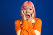 canvas print picture Asian girl with pink hair and piercing expressing surprise at camera