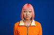 canvas print picture Asian girl with pink hair and piercing frowning while looking at camera