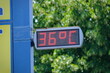 Street thermometer marking 36 degrees celsius in summer