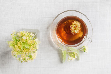 Wall Mural - Linden herbal tea on a light pastel background. copy space