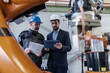© Halfpoint - Engineering manager and mechanic worker doing routine check up in industrial factory