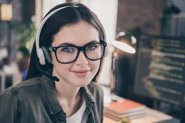 Portrait of attractive skilled girl tech agent support expert answering calls helpdesk hotline at workplace workstation indoors