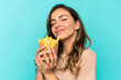 © luismolinero - Young woman holding fried chips over isolated background