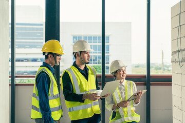 Team work Asian people Engineer or Architect team at construction site. Concept technology in construction business. Asian worker.