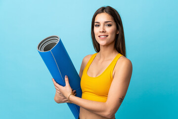 Poster - Young caucasian with mat isolated on blue background