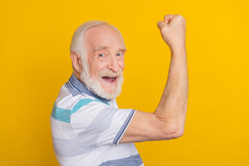 Profile side view portrait of attractive cheerful grey haired man having fun attainment isolated over shine yellow color background