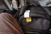 Cabin bag in front of seet on economy class flight