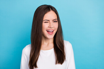 portrait of adorable playful lady winking eye flirting with her boyfriend go on date isolated on blu