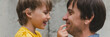 © Ksenia - man dad having quality time with their kid son boy six year old on arms. happy father playing together with child. real life authentic day-to-day fatherhood moments. fatherly love care. banner
