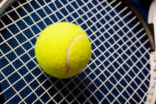Yellow Tennis Ball And Racket Close Up