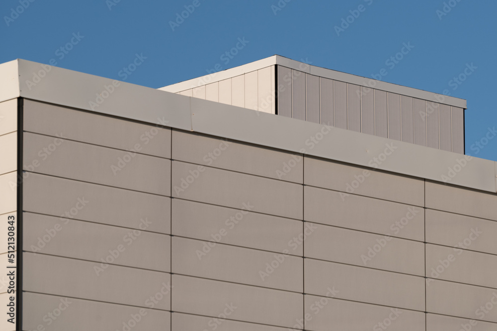 The wall of a commercial building made of precast concrete panels and ...