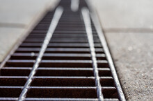 Grate Over A Stormwater Trench In A Concrete Slab. 