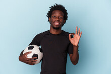 Young African American Man Playing Soccer Isolated On Blue Background Cheerful And Confident Showing Ok Gesture.