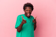 © Asier - Young african american man isolated on pink background pointing to front with fingers.