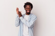 © Asier - Young african american man isolated on white background  feeling energetic and comfortable, rubbing hands confident.