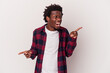 © Asier - Young african american man isolated on white background  pointing to different copy spaces, choosing one of them, showing with finger.