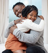 © Wayde O/peopleimages.com - I love you Dad. Shot of a young father hugging his daughter while bonding at home.