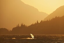 Windsurfer At The Columbia River Gorge. Windsurfers From Around The Globe Gather At The Columbia River Gorge For Its Prime Windsurfing Conditions.