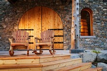 Rocking Chairs On The Front Porch Of A Winery.