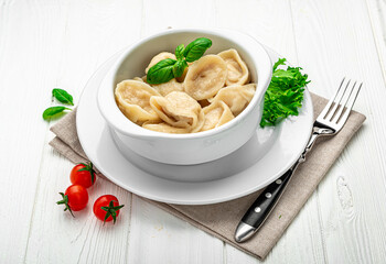 Wall Mural - Plate with delicious handmade dumplings on white background