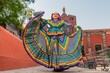 Young Mexican woman in a traditional folklore dress of many colors, traditional dancer.