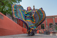 Young Mexican Woman In A Traditional Folklore Dress Of Many Colors, Traditional Dancer.