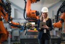 Female Chief Engineer In Modern Industrial Factory Using Tablet And Making Audit.