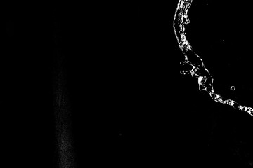  water splashes isolated on black background. white jets with drops