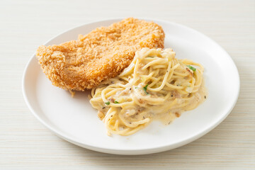 spaghetti pasta white cream sauce with fried fish