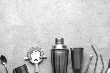 Bartender utensils on grey background