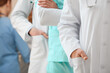 © Pixel-Shot - Group of doctors in clinic, closeup