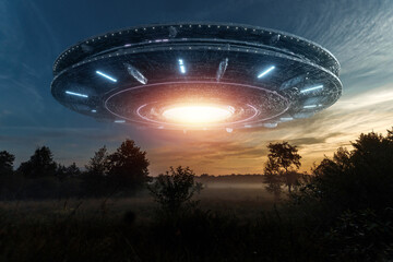 Wall Mural - ufo, an alien saucer hovering above the field in the clouds, hovering motionless in the sky. unident