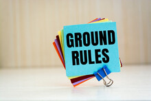 Notebook With Text GROUND RULES On Office Table With Office Supplies.