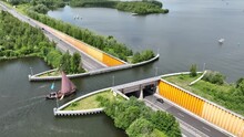 Aqueduct Veluwemeer Near Harderwijk Transport Asphalt Motorway Road For Traffic Crossing Underneath A Waterway River Lake Infrastructure In The Netherlands. Holland