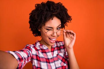 Sticker - Portrait of excited lady make selfie photo wink eye enjoy travel wear plaid shirt isolated shine color background