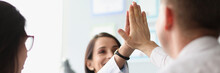 Colleagues Give High Five After Successful Agreement With Partners