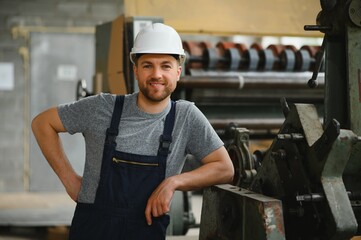 Wall Mural - Factory worker. Man working on the production line.