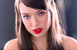 Close-up of Beautiful Caucasian Woman With Cat Blue Eyes, Full Red Lips and Open Mouth Looking Romantic on Grey Background